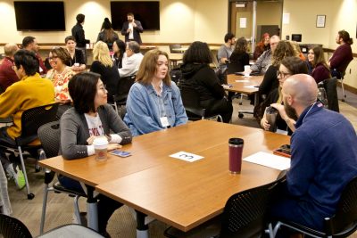 New faculty and staff interact at a speed meeting held in Carol M. Newman Library. 
