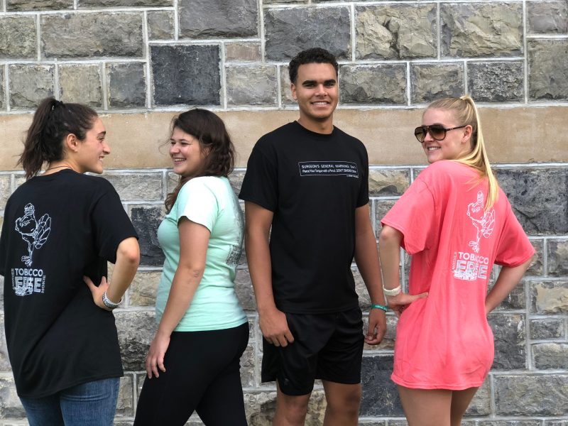 various students wearing tobacco free hokie shirts